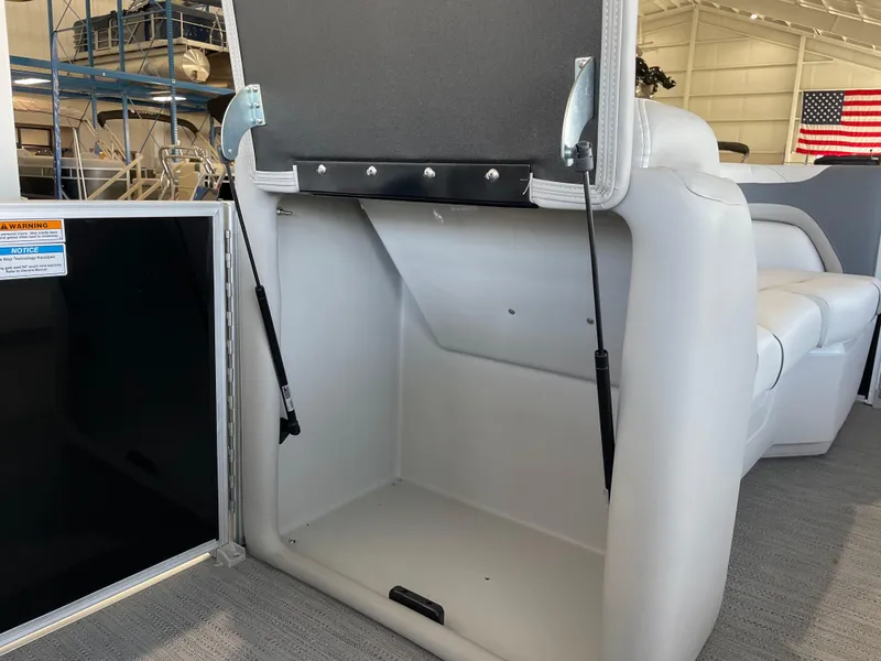Slide: The Image of Open storage compartment in 2025 Godfrey Sweetwater 2086 C pontoon boat. - 19