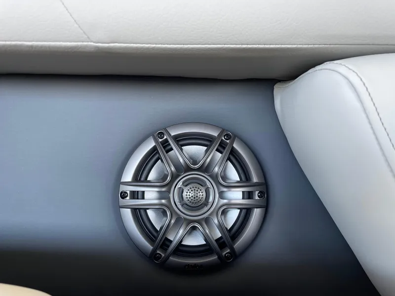 Slide: The Image of Speaker on 2025 Godfrey Sweetwater 2086 C boat, integrated in white seating area. - 21