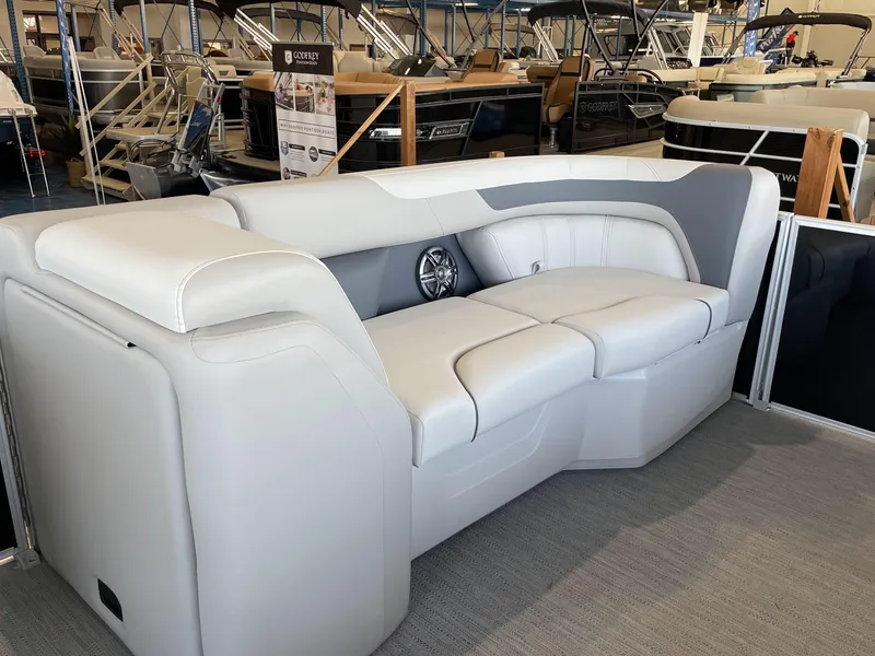 Slide: The Image of 2025 Godfrey Sweetwater 2086 C pontoon boat seating in showroom display. - 5