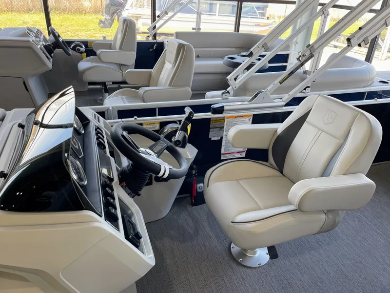 Slide: The Image of 2025 Godfrey Sweetwater 2086 C boat interior with modern helm and comfortable seating. - 9