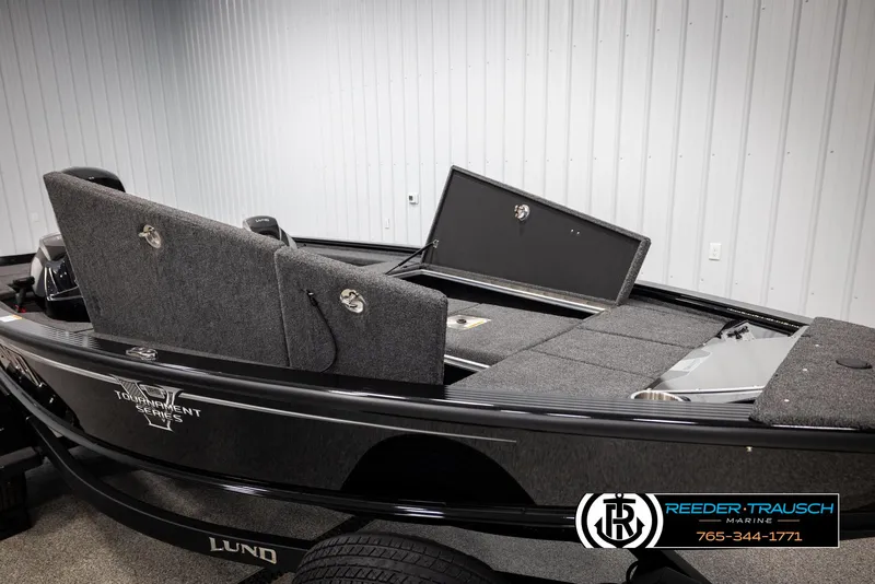 Slide: The Image of 2025 Lund 1875 Pro V Bass XS boat, interior view, featuring storage compartments and seating. - 12