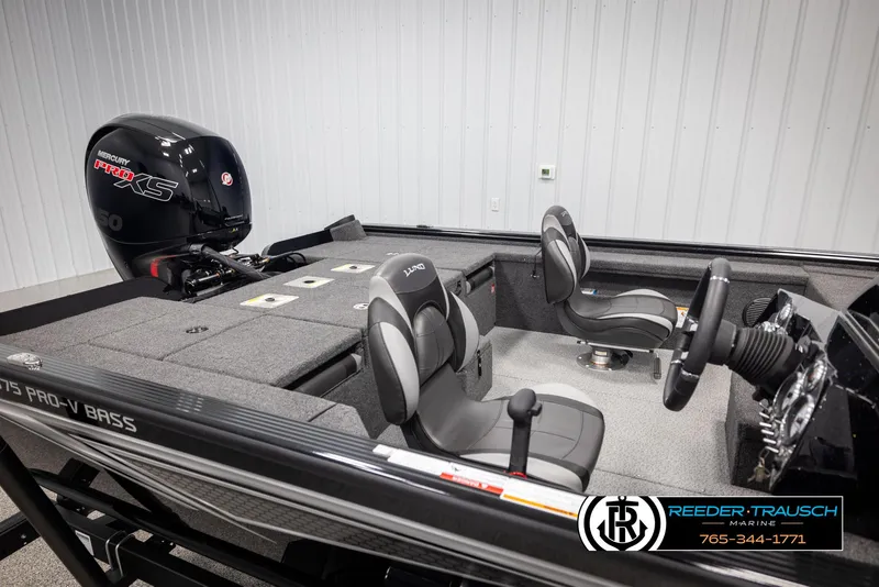 Slide: The Image of 2025 Lund 1875 Pro V Bass XS boat interior with Mercury Pro XS engine, featuring sleek seating. - 14