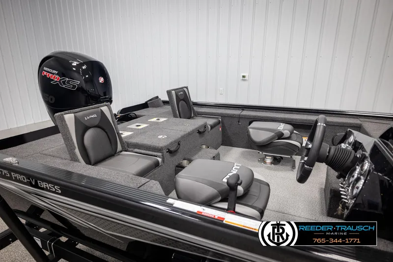Slide: The Image of 2025 Lund 1875 Pro V Bass XS boat interior with Mercury Pro XS engine, gray seating, and steering console. - 15