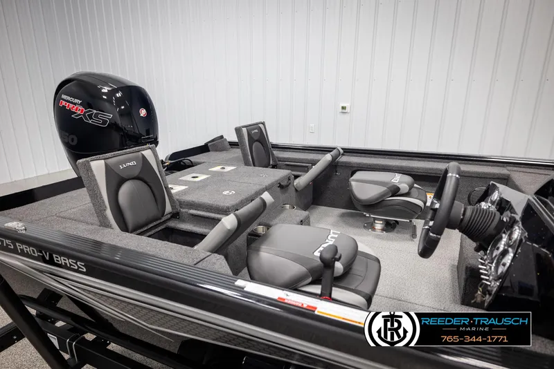 Slide: The Image of 2025 Lund 1875 Pro V Bass XS boat interior with Mercury engine, featuring comfortable seating and modern controls. - 16