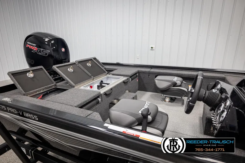Slide: The Image of 2025 Lund 1875 Pro V Bass XS boat interior with Mercury Pro XS engine, open storage compartments. - 17