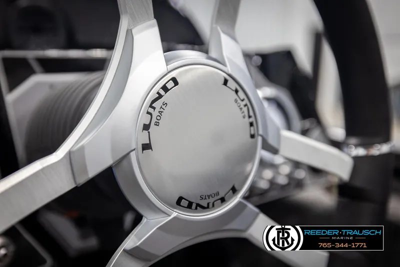 Slide: The Image of Steering wheel of 2025 Lund 1875 Pro V Bass XS boat, close-up view. - 22