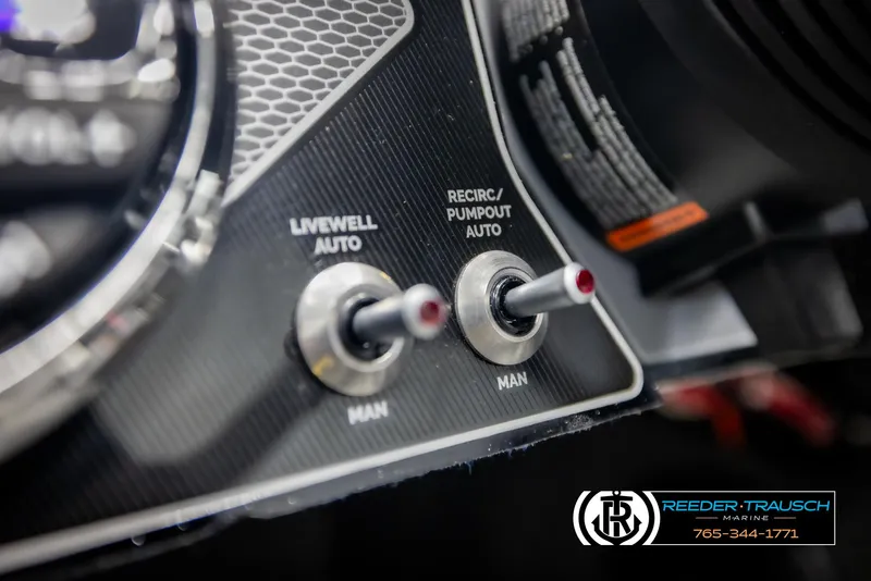 Slide: The Image of Close-up of 2025 Lund 1875 Pro V Bass XS control panel with switches. - 23