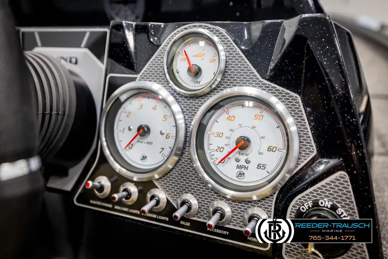 Slide: The Image of Dashboard of 2025 Lund 1875 Pro V Bass XS boat with gauges and controls. - 24