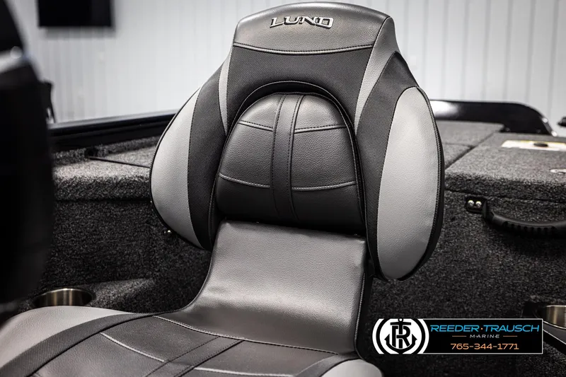 Slide: The Image of 2025 Lund 1875 Pro V Bass XS boat seat, black and gray design, Reeder-Trausch Marine logo. - 26