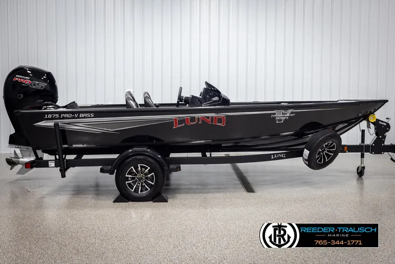 Slide: The Image of 2025 Lund 1875 Pro V Bass XS boat on trailer in showroom. - 3