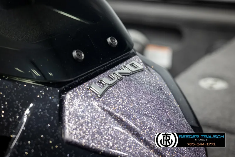 Slide: The Image of 2025 Lund 1875 Pro V Bass XS boat with glittery finish and logo detail. - 30
