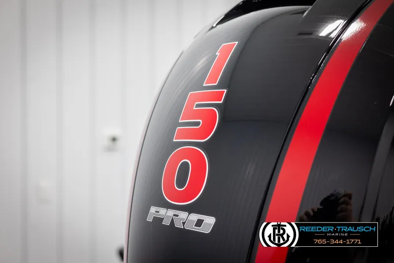 Slide: The Image of Close-up of 2025 Lund 1875 Pro V Bass XS engine with red '150 Pro' decal. - 39
