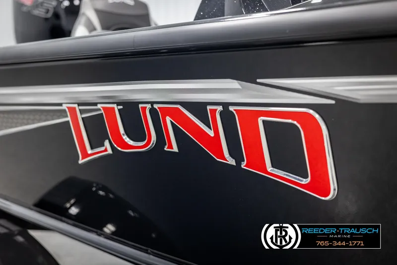 Slide: The Image of 2025 Lund 1875 Pro V Bass XS boat with bold red logo and sleek design. - 41