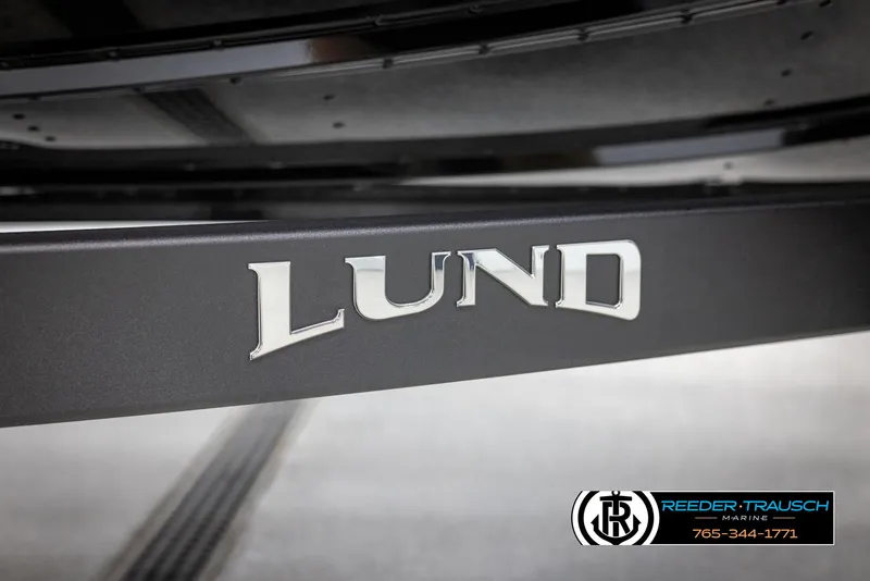 Slide: The Image of 2025 Lund 1875 Pro V Bass XS boat logo on trailer, Reeder-Trausch Marine branding. - 45