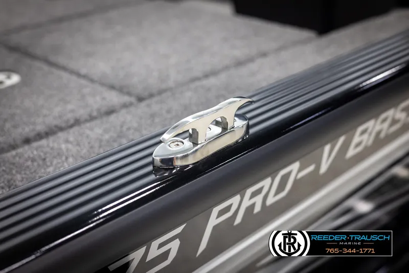 Slide: The Image of 2025 Lund 1875 Pro V Bass XS boat detail with cleat, Reeder-Trausch Marine logo visible. - 49