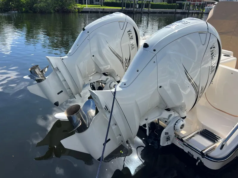 Slide: The Image of 2023 Grady-White 336 Canyon with twin Yamaha outboard engines on calm water. - 106