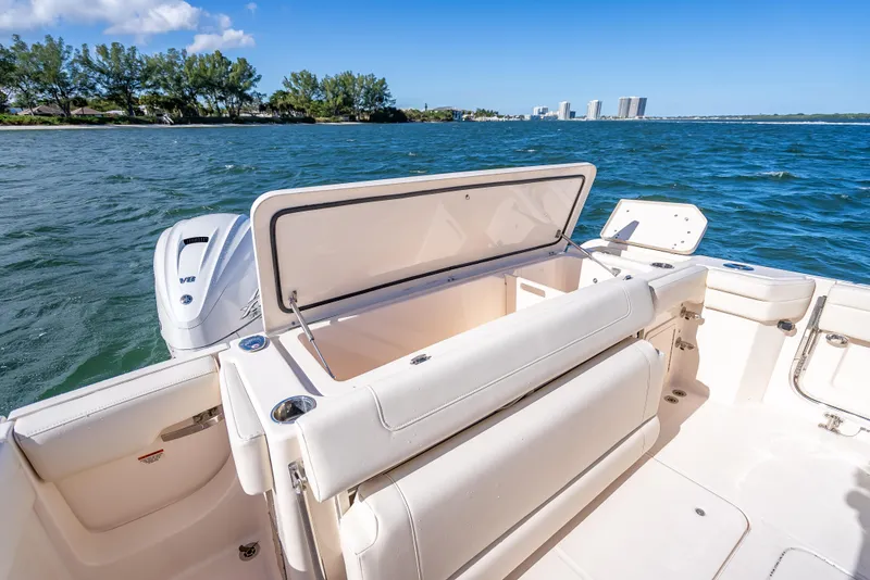 Slide: The Image of 2023 Grady-White 336 Canyon boat with open storage, on a sunny day at sea. - 41