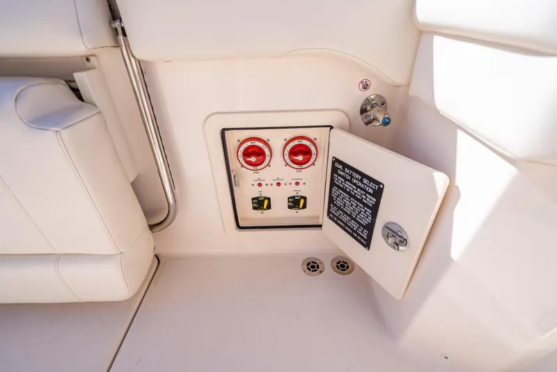 Slide: The Image of 2023 Grady-White 336 Canyon boat battery control panel with dual switches. - 42