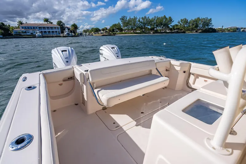 Slide: The Image of 2023 Grady-White 336 Canyon boat interior with dual engines on a sunny day. - 43