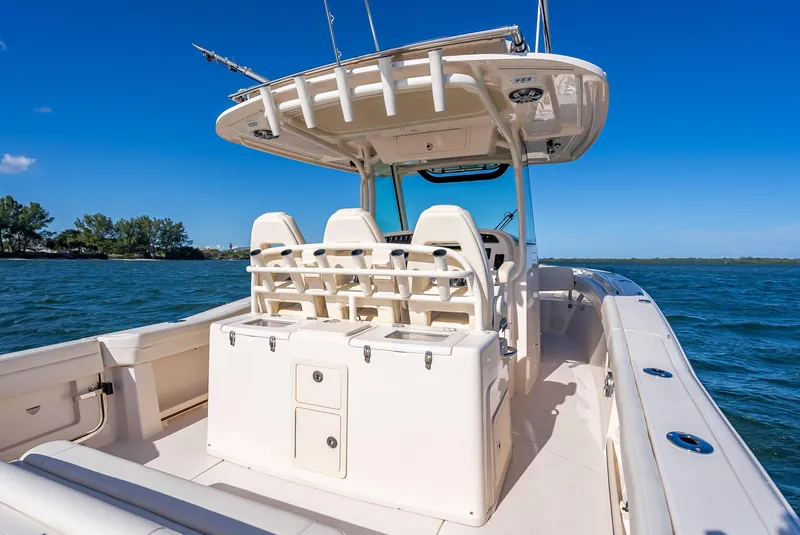 Slide: The Image of 2023 Grady-White 336 Canyon boat on open water, clear blue sky. - 44