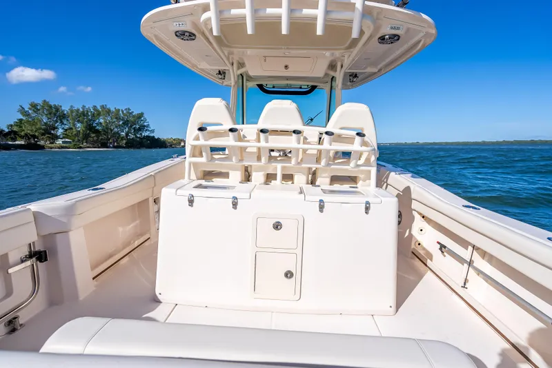 Slide: The Image of 2023 Grady-White 336 Canyon boat interior on open water, clear blue sky. - 47