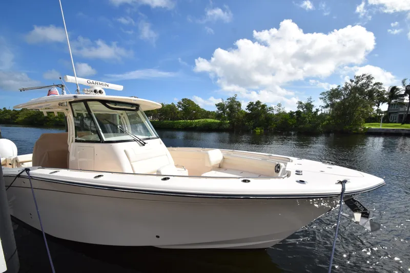 Slide: The Image of 2023 Grady-White 336 Canyon boat docked on a sunny day. - 61