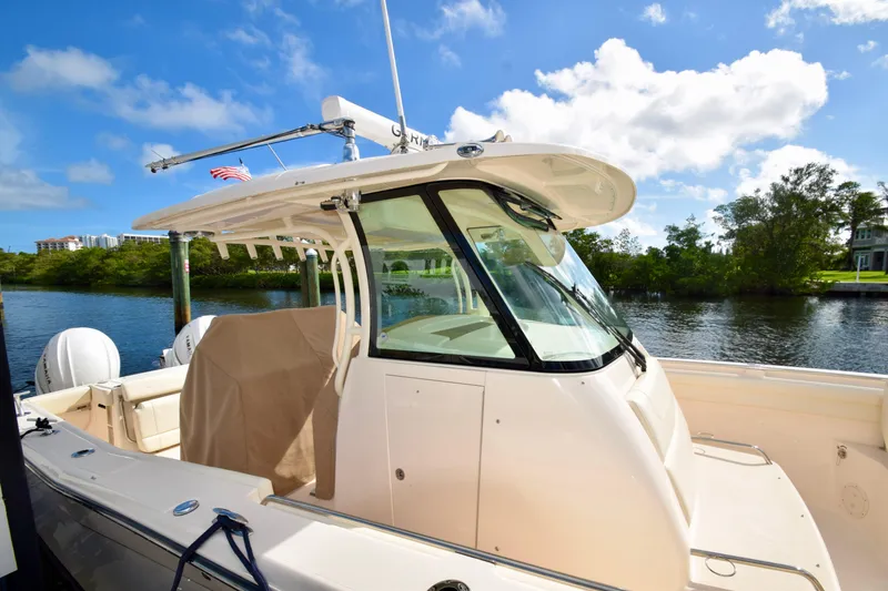 Slide: The Image of 2023 Grady-White 336 Canyon boat docked on a sunny day. - 62