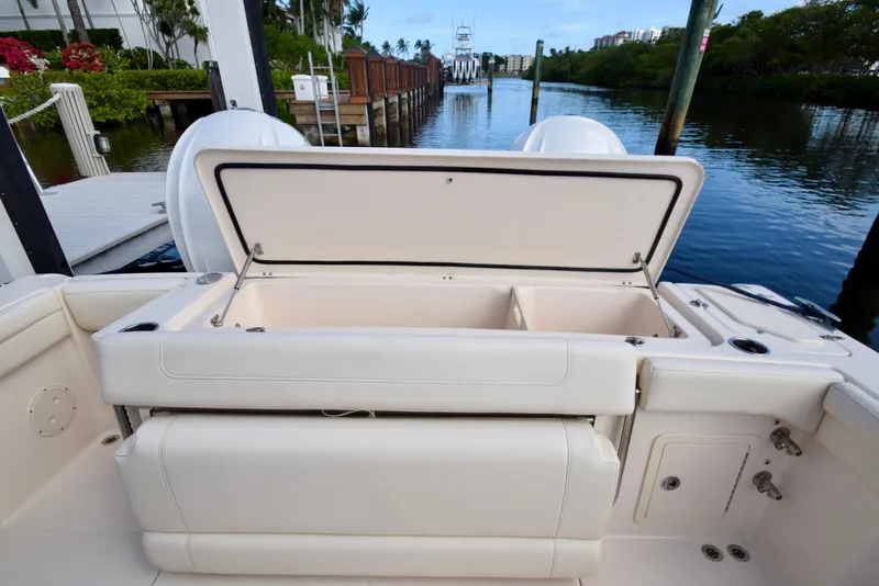 Slide: The Image of 2023 Grady-White 336 Canyon boat with open storage compartment by the dock. - 65