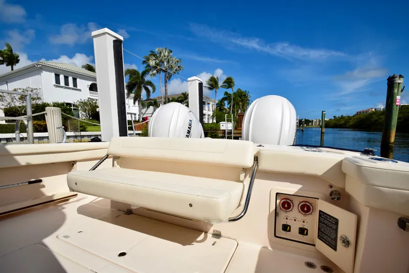 Slide: The Image of 2023 Grady-White 336 Canyon boat interior at dock, sunny day, waterfront view. - 68