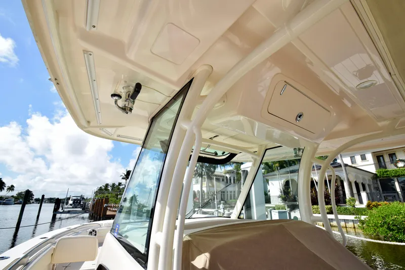 Slide: The Image of 2023 Grady-White 336 Canyon boat interior, featuring sleek design and waterfront view. - 76