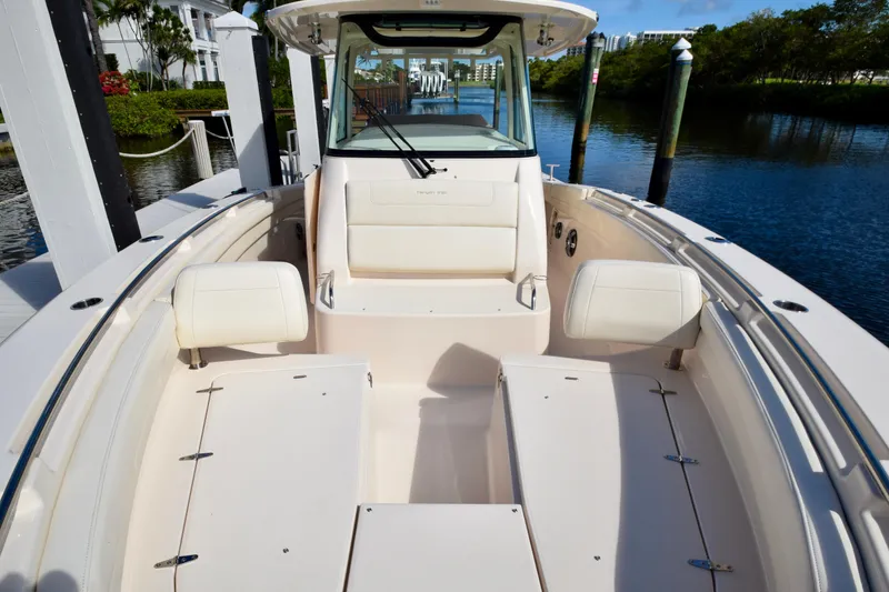 Slide: The Image of 2023 Grady-White 336 Canyon boat interior, featuring spacious seating and sleek design. - 89