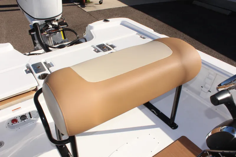 Slide: The Image of 2025 NauticStar 214 Shallow Bay boat seat, tan and white upholstery, sleek design. - 16