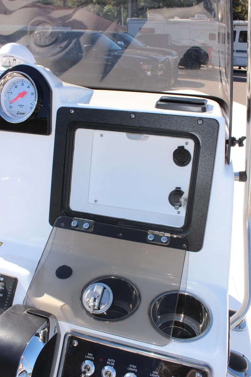 Slide: The Image of 2025 NauticStar 214 Shallow Bay boat dashboard with gauges and controls. - 17