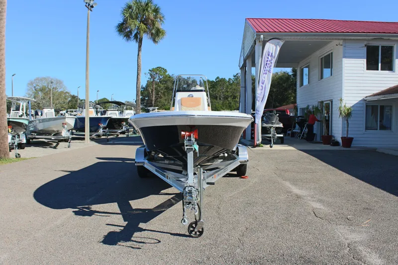 Slide: The Image of 2025 NauticStar 214 Shallow Bay boat on trailer at dealership. - 4