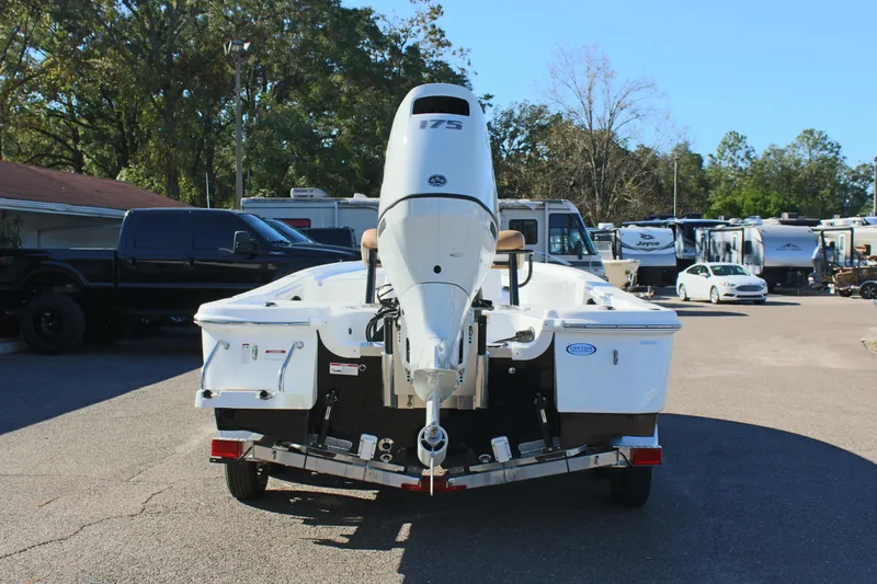 Slide: The Image of 2025 NauticStar 214 Shallow Bay boat on trailer, rear view in parking lot. - 9
