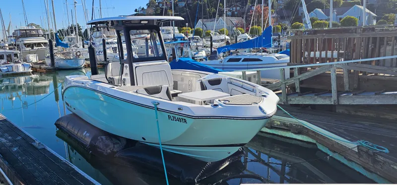 Slide: The Image of 2023 Yamaha Boats 255 FSH Sport E docked in a marina. - 5