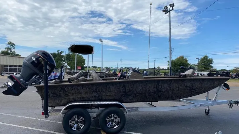 Slide: The Image of 2025 Xpress XP200 Catfish boat on trailer in parking lot. - 0