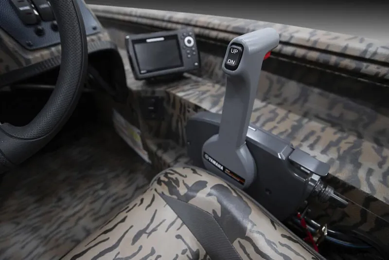 Slide: The Image of 2025 Xpress XP200 Catfish boat interior with camo design and control lever. - 3