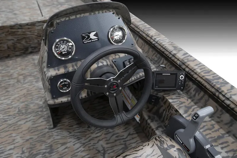 Slide: The Image of 2025 Xpress XP200 Catfish boat dashboard with steering wheel and gauges. - 4