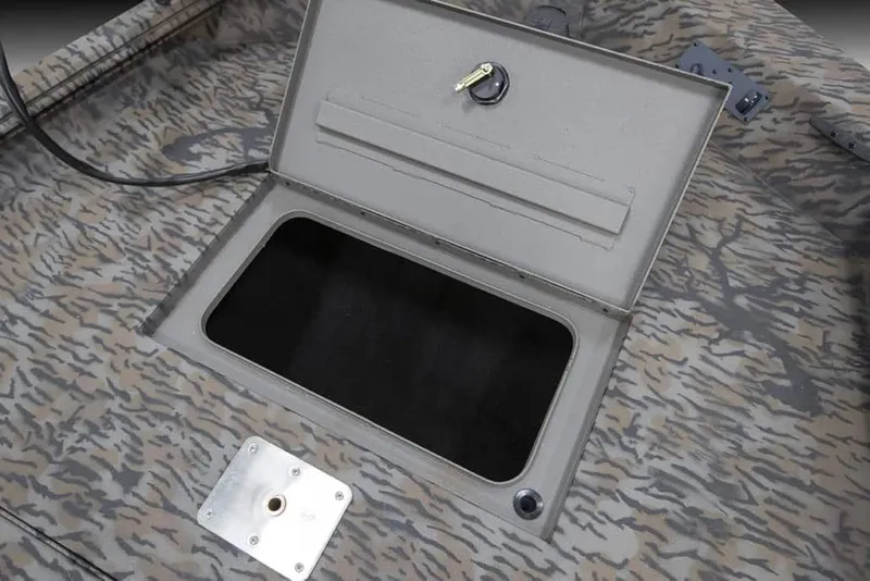 Slide: The Image of 2025 Xpress XP200 Catfish boat storage compartment with camo design and secure lock. - 6
