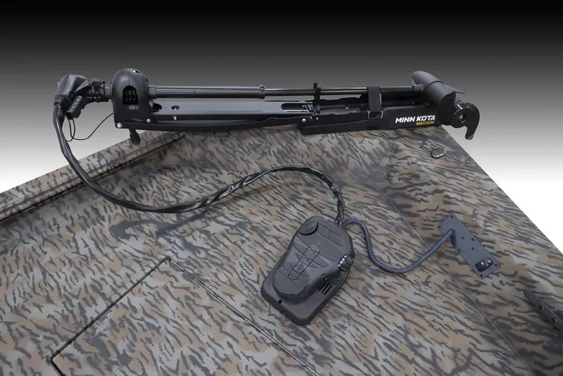 Slide: The Image of 2025 Xpress XP200 Catfish boat with Minn Kota trolling motor on camo deck. - 7