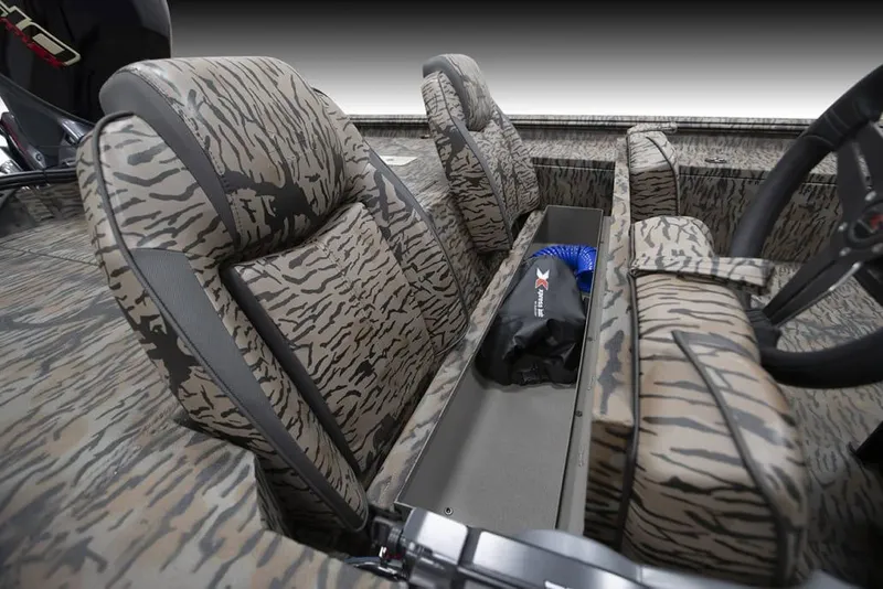 Slide: The Image of 2025 Xpress XP200 Catfish boat interior with camo seats and storage compartment. - 8