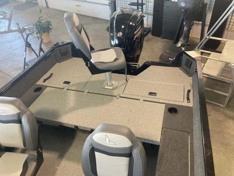 Slide: The Image of 2025 Lowe FM 1775 SC boat with console and motor. - 17