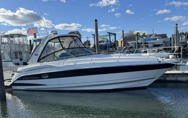 The Image of 2018 Monterey 335 SY boat docked in marina under blue sky. - 0