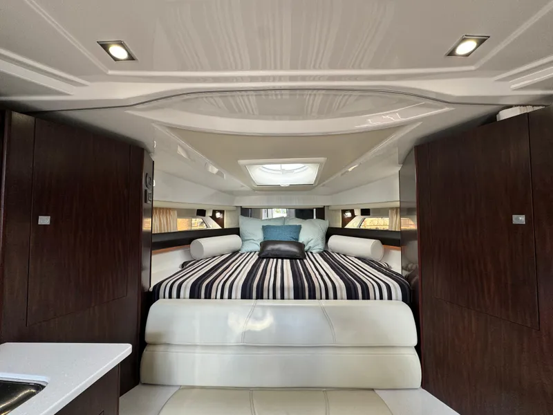 Slide: The Image of Luxurious interior of 2018 Monterey 335 SY yacht with elegant bedding and modern design. - 23