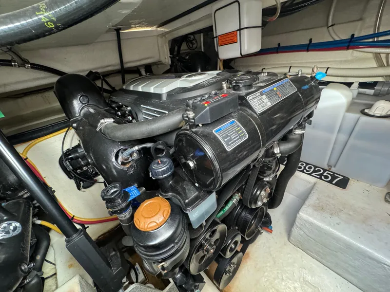 Slide: The Image of Engine compartment of a 2018 Monterey 335 SY boat, showcasing detailed mechanical components. - 25