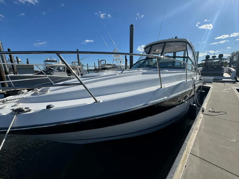 Slide: The Image of 2018 Monterey 335 SY boat docked under a clear blue sky. - 4