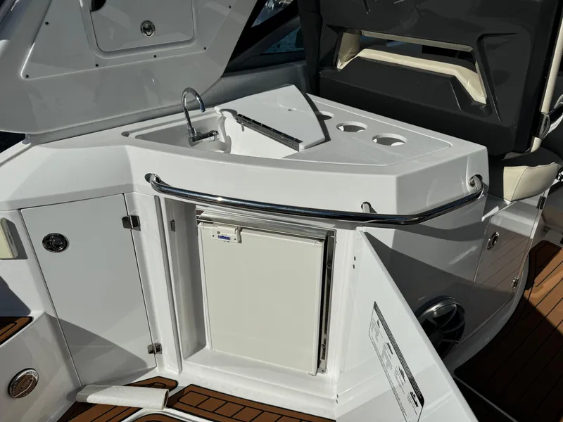 Slide: The Image of 2018 Monterey 335 SY yacht kitchenette with sink, storage, and cup holders. - 8