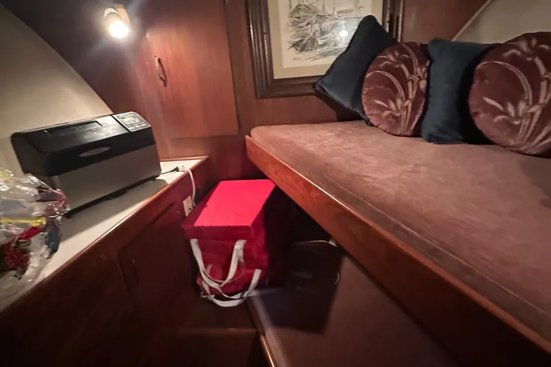 Slide: The Image of Interior cabin of 1974 Hatteras 58 Yachtfish with cozy bed and decor. - 23