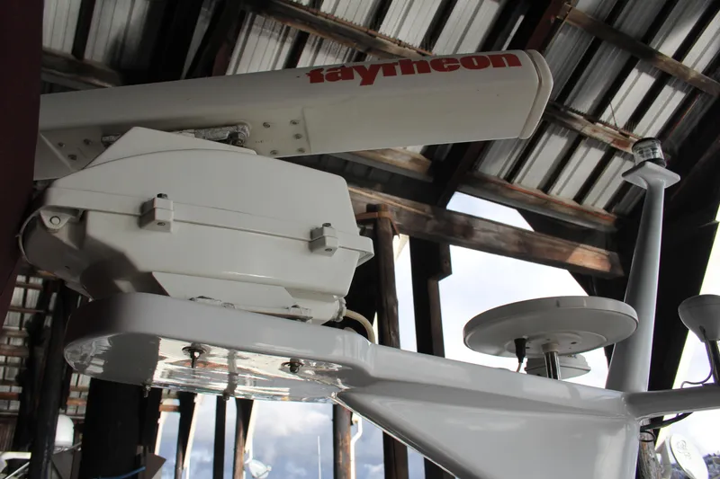 Slide: The Image of Radar equipment on a 1974 Hatteras 58 Yachtfish under a metal roof. - 36